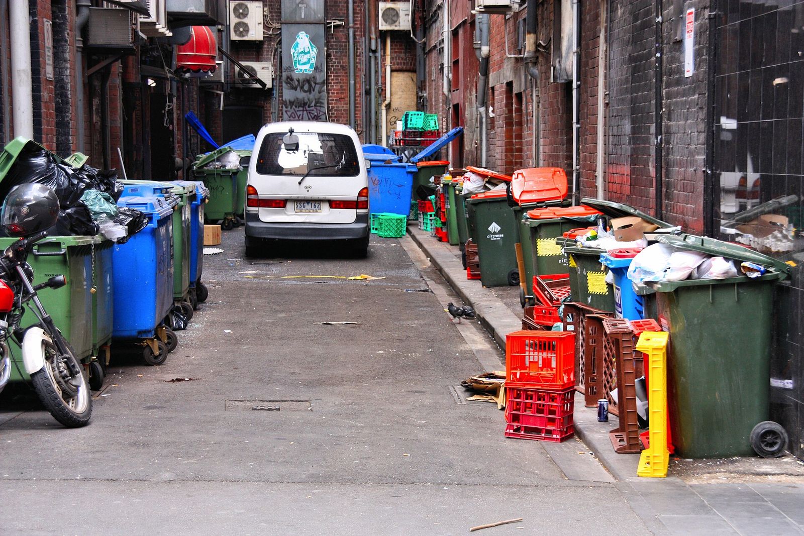 Restaurant trash bins in a back street
