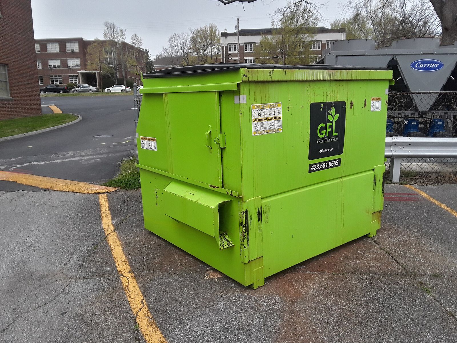 A bright green dumpster in Jefferson City